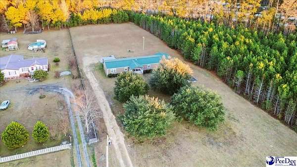 11.7 Acres of Land with Home for Sale in Timmonsville, South Carolina