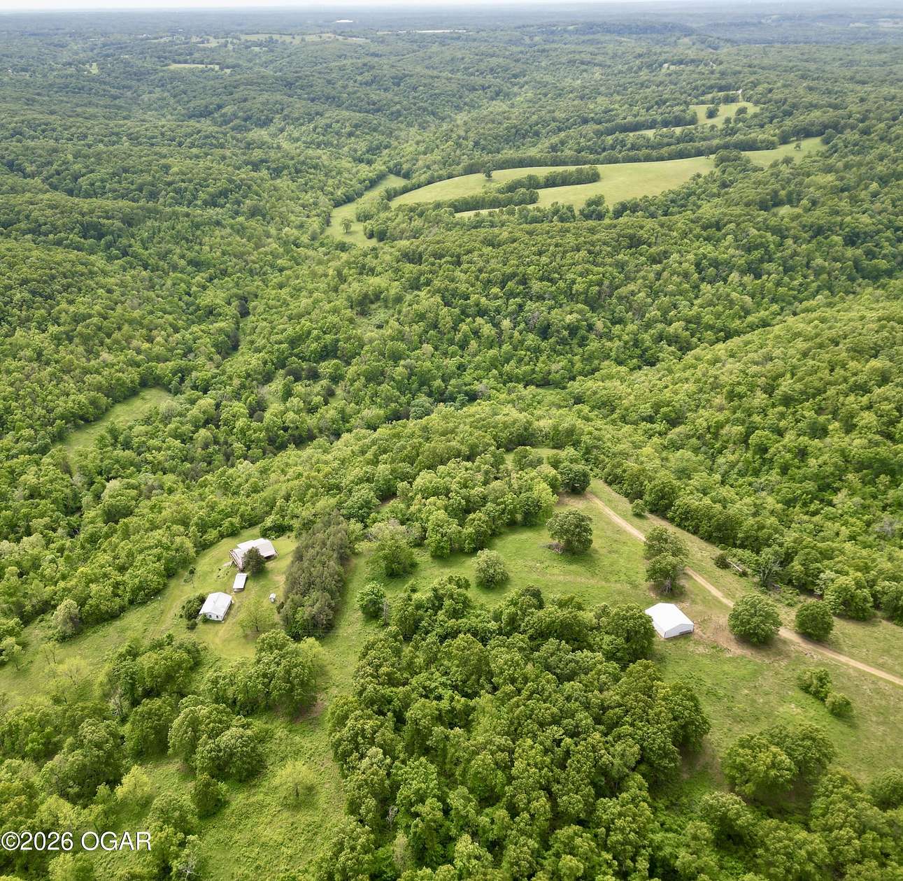 194 Acres of Land with Home for Sale in Pineville, Missouri