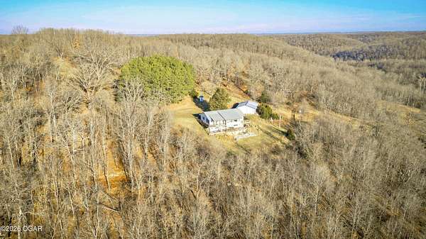 194 Acres of Land with Home for Sale in Pineville, Missouri