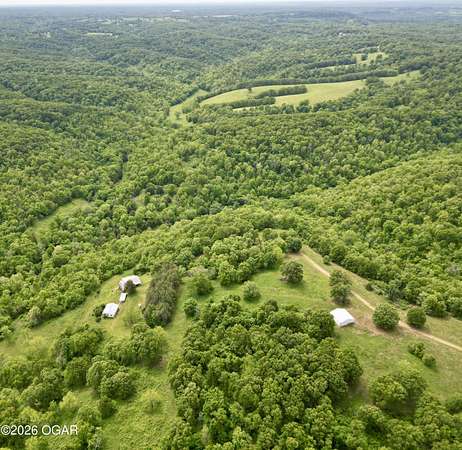 194 Acres of Land with Home for Sale in Pineville, Missouri