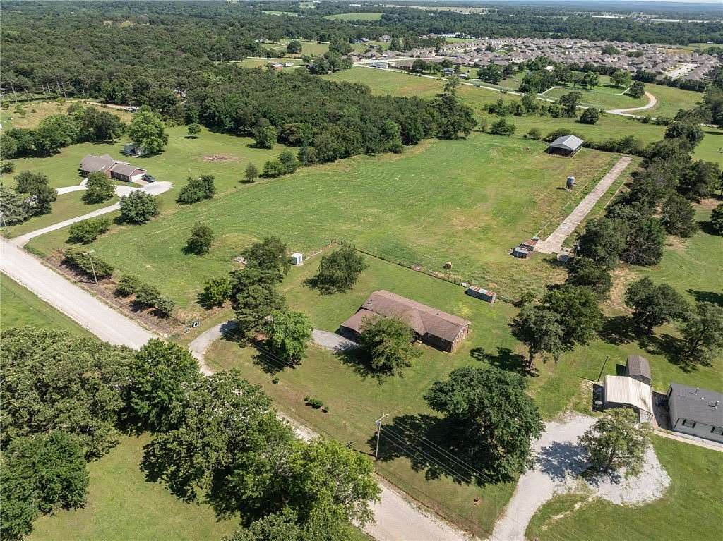 7.47 Acres of Land with Home for Sale in Gentry, Arkansas