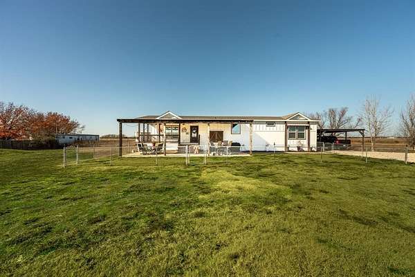 9.82 Acres of Residential Land with Home for Lease in Caddo Mills, Texas