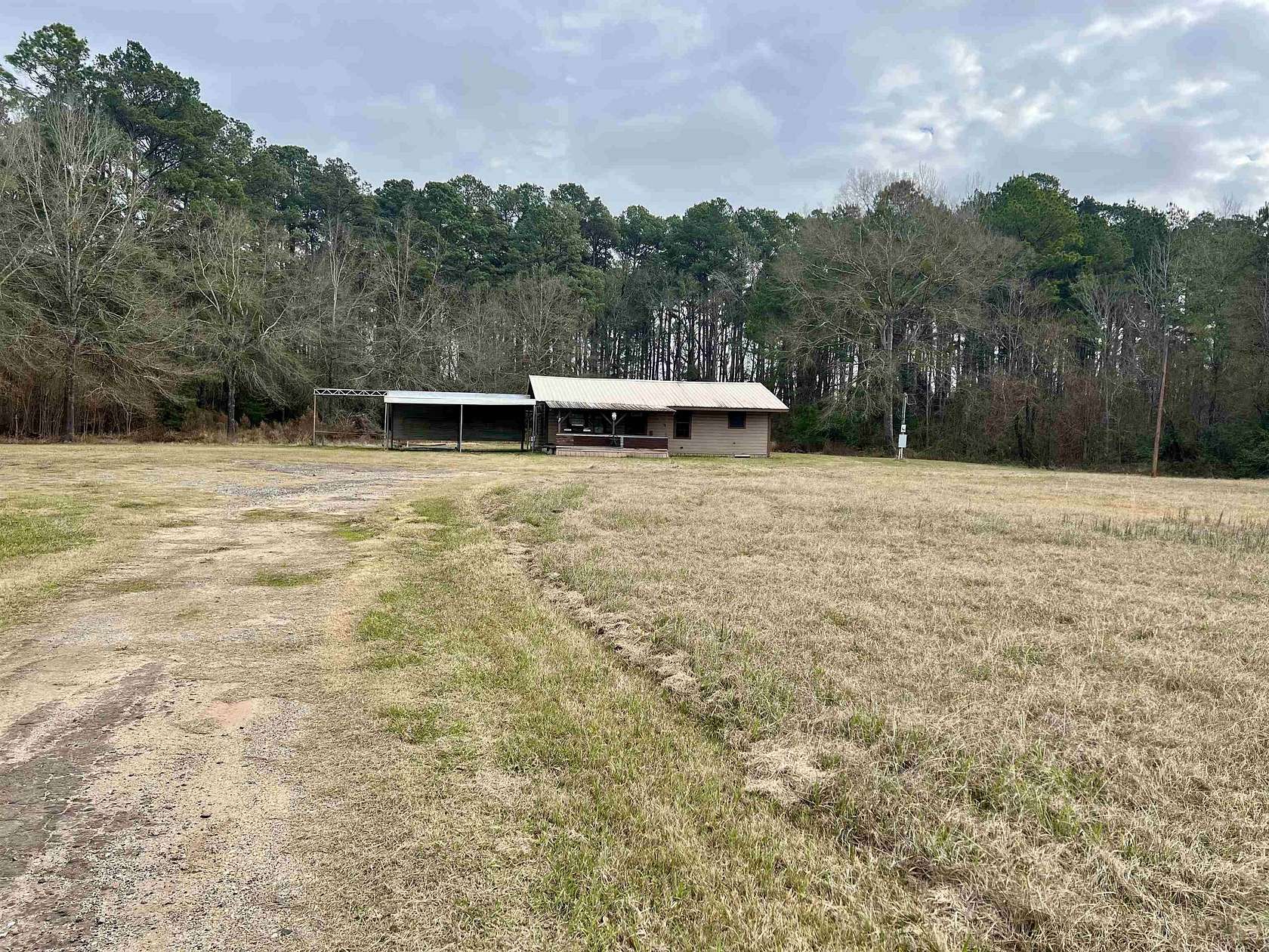 2 Acres of Residential Land with Home for Sale in Carthage, Texas