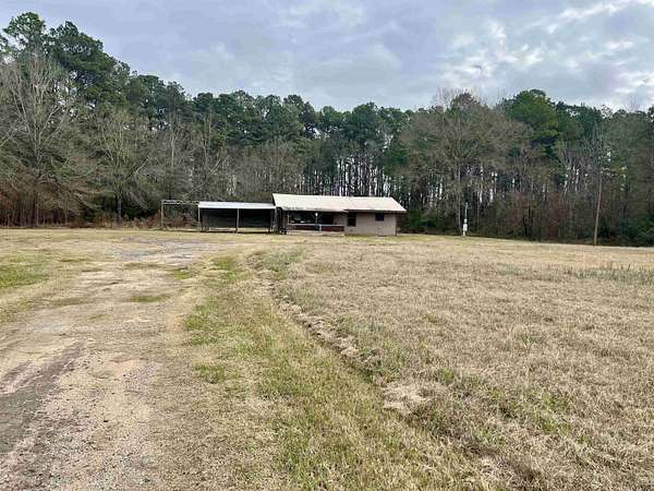 2 Acres of Residential Land with Home for Sale in Carthage, Texas