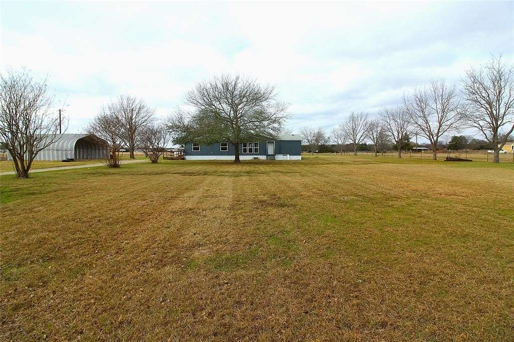 1.5 Acres of Residential Land with Home for Sale in Scurry, Texas