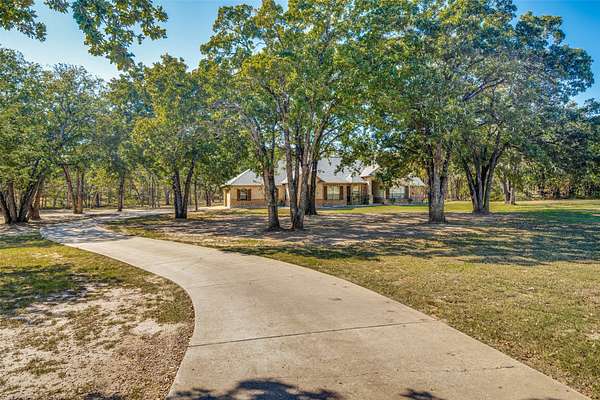 2.65 Acres of Land with Home for Sale in Scurry, Texas