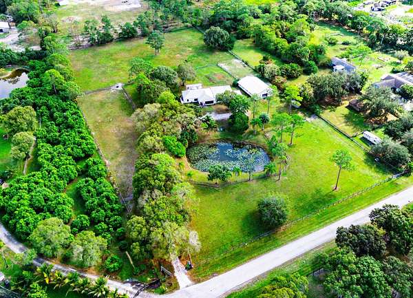 5.22 Acres of Residential Land with Home for Sale in Loxahatchee Groves, Florida