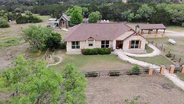 6.49 Acres of Land with Home for Sale in Concan, Texas