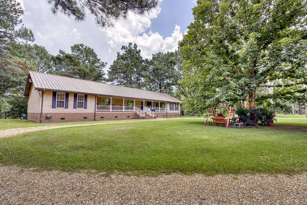 38.6 Acres of Land with Home for Sale in Carriere, Mississippi