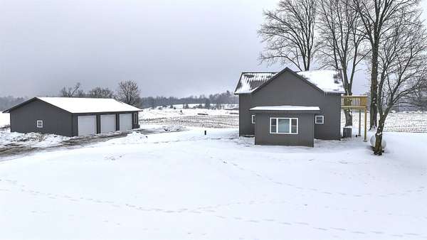 1.63 Acres of Residential Land with Home for Sale in Hatley, Wisconsin