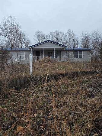 5 Acres of Residential Land with Home for Sale in Olive Hill, Kentucky