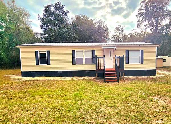 4.5 Acres of Residential Land with Home for Sale in Chiefland, Florida