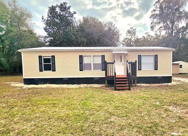 4.5 Acres of Residential Land with Home for Sale in Chiefland, Florida