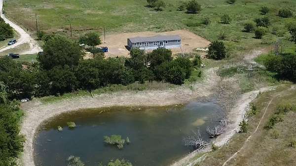 7.37 Acres of Land with Home for Sale in Cresson, Texas