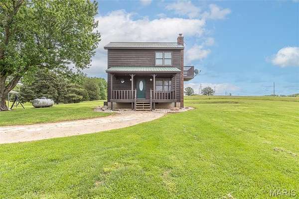 71.3 Acres of Land with Home for Sale in Bloomfield, Missouri