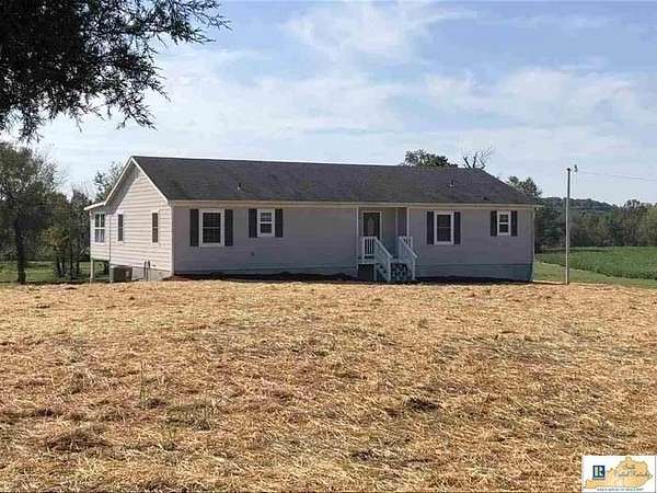 7.42 Acres of Residential Land with Home for Sale in Scottsville, Kentucky