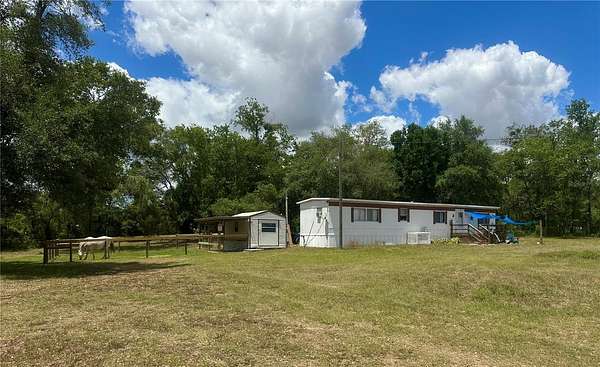 2.5 Acres of Land with Home for Sale in Morriston, Florida