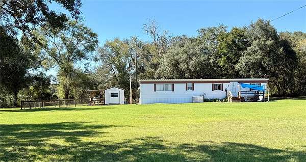 2.5 Acres of Land with Home for Sale in Morriston, Florida