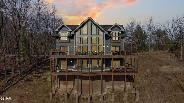 5.58 Acres of Residential Land with Home for Sale in Sevierville, Tennessee