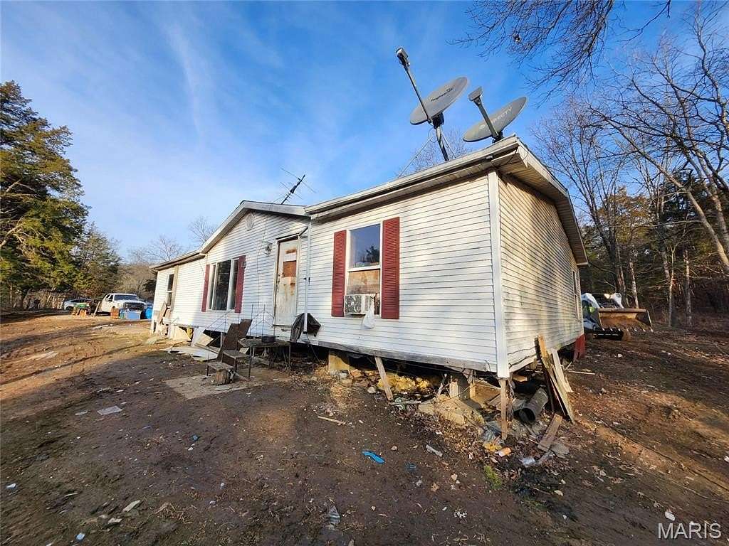 5.6 Acres of Land with Home for Sale in De Soto, Missouri