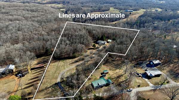 8.3 Acres of Land with Home for Sale in Vanleer, Tennessee