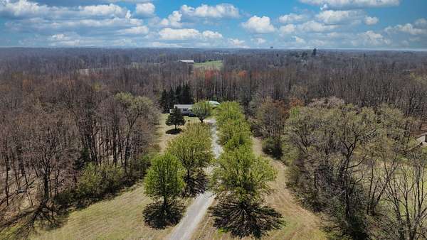 8.3 Acres of Land with Home for Sale in Vanleer, Tennessee