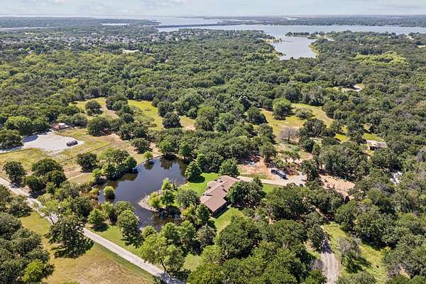 22.7 Acres of Land with Home for Sale in Hickory Creek, Texas