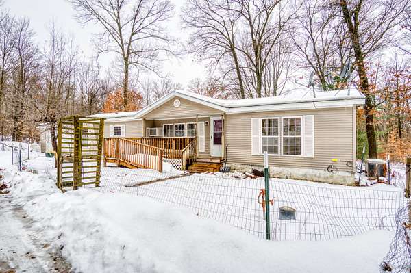 2.5 Acres of Residential Land with Home for Sale in White Cloud, Michigan