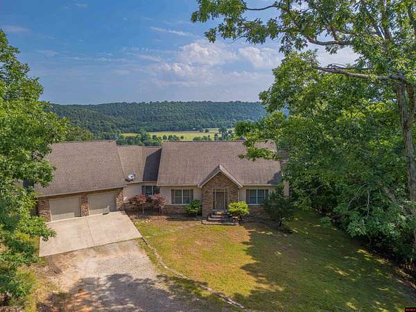 3.27 Acres of Land with Home for Sale in Flippin, Arkansas