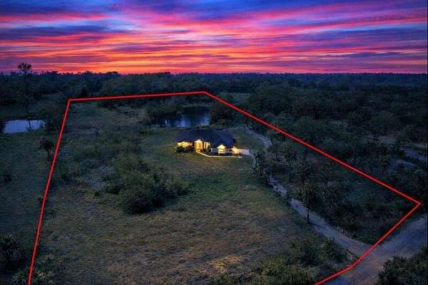 5.2 Acres of Land with Home for Sale in The Acreage, Florida