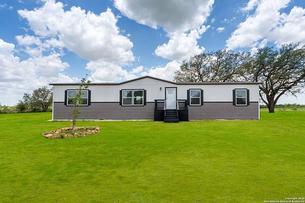 2.23 Acres of Residential Land with Home for Sale in Poteet, Texas