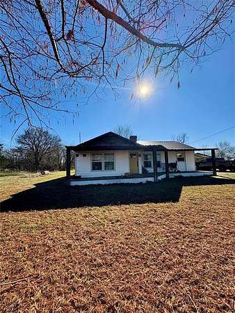 11 Acres of Land with Home for Sale in Deport, Texas