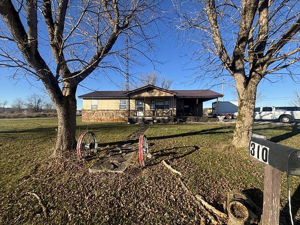 1.5 Acres of Residential Land with Home for Sale in Deer Lodge, Tennessee