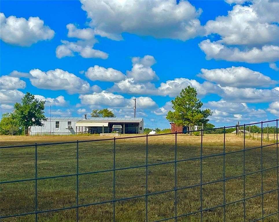 10 Acres of Land with Home for Sale in Prague, Oklahoma