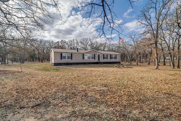1.67 Acres of Residential Land with Home for Sale in Scurry, Texas