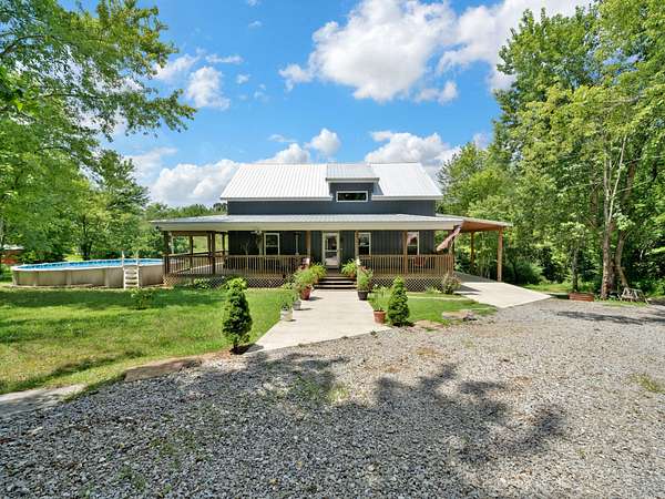 7.5 Acres of Residential Land with Home for Sale in Burns, Tennessee