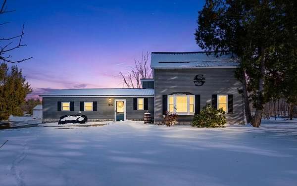 2.9 Acres of Land with Home for Sale in Comins, Michigan