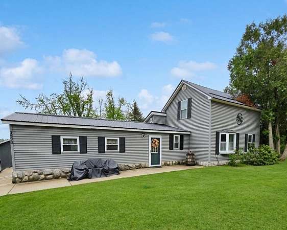 2.9 Acres of Land with Home for Sale in Comins, Michigan