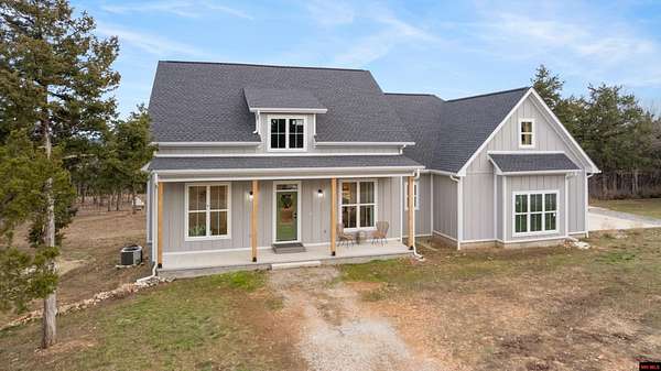 4.68 Acres of Land with Home for Sale in Flippin, Arkansas