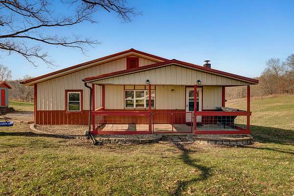 14.3 Acres of Land with Home for Sale in Crane, Missouri