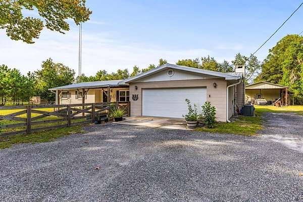 2.5 Acres of Land with Home for Sale in Chiefland, Florida