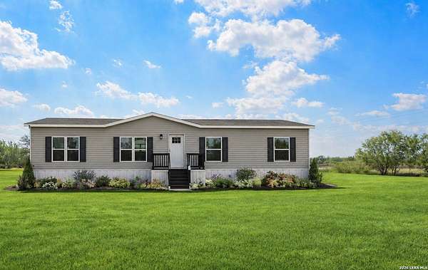 5 Acres of Land with Home for Sale in Lytle, Texas
