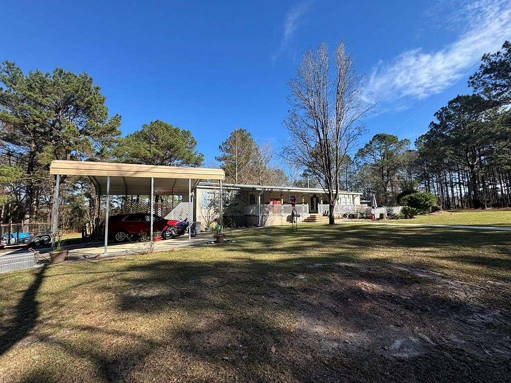 5.84 Acres of Land with Home for Sale in Carriere, Mississippi