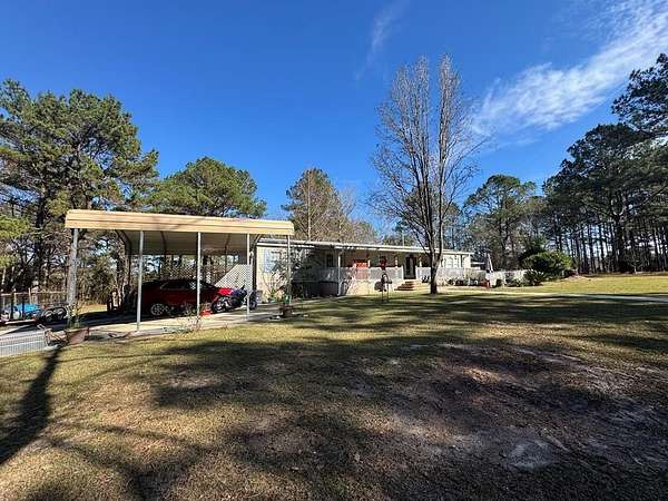 5.84 Acres of Land with Home for Sale in Carriere, Mississippi
