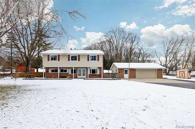 6.6 Acres of Residential Land with Home for Sale in Pinckney, Michigan