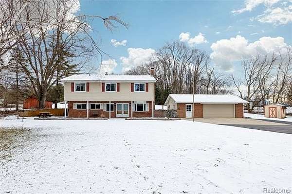 6.6 Acres of Residential Land with Home for Sale in Pinckney, Michigan