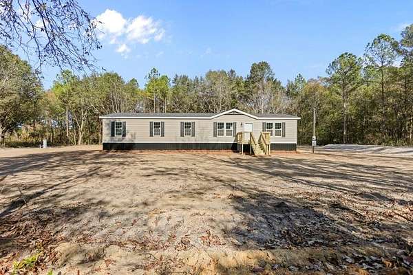 3.28 Acres of Residential Land with Home for Sale in Ludowici, Georgia
