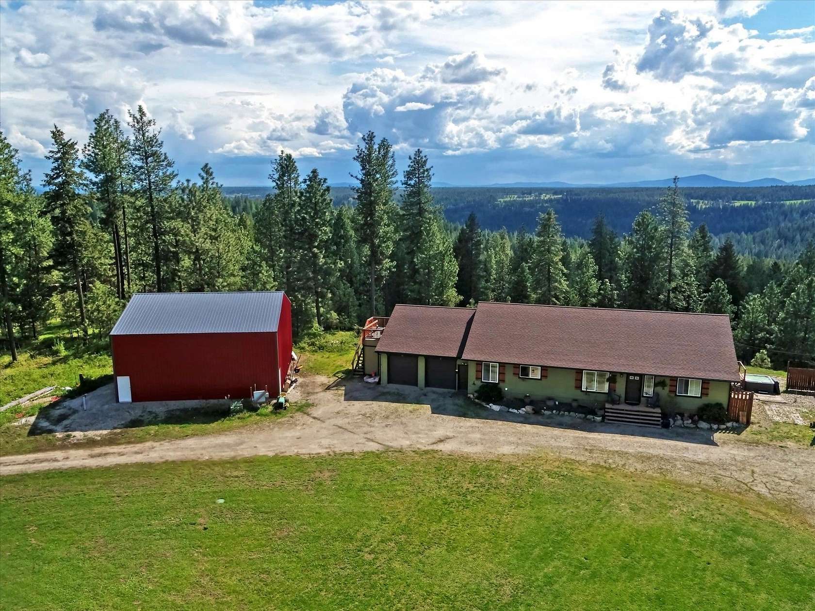 11.1 Acres of Recreational Land with Home for Sale in Elk, Washington