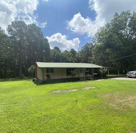 10.3 Acres of Land with Home for Sale in El Dorado, Arkansas