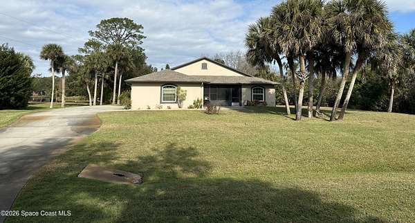 2.5 Acres of Residential Land with Home for Sale in Titusville, Florida